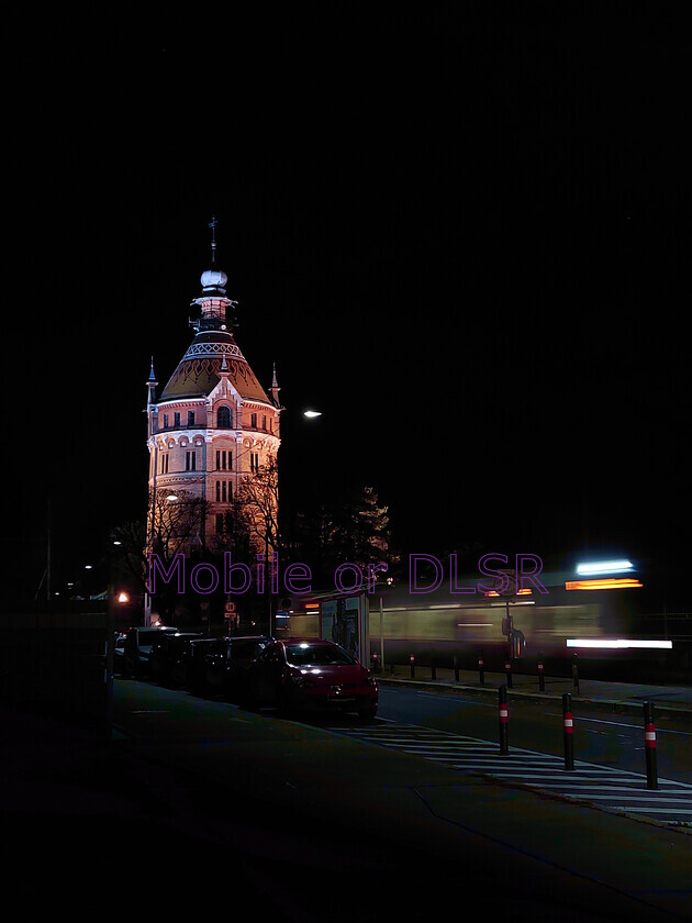 20241128 221259x 
 Wasserturm Favoriten water tower in Vienna 
 Keywords: water tower, tram, long exsposure, movement